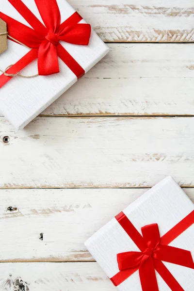 White gift box on white wooden background