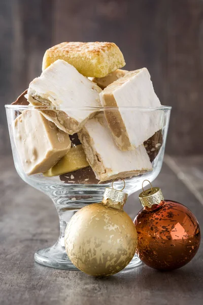 Variety of Christmas nougat in crystal glass and christmas ball — Stock Photo, Image