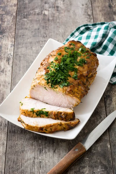 Roasted pork on wooden table — Stock Photo, Image