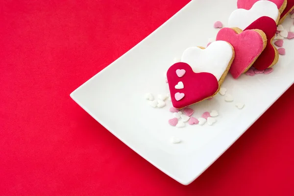 Valentine cookies with heart shape on red background — Stock Photo, Image