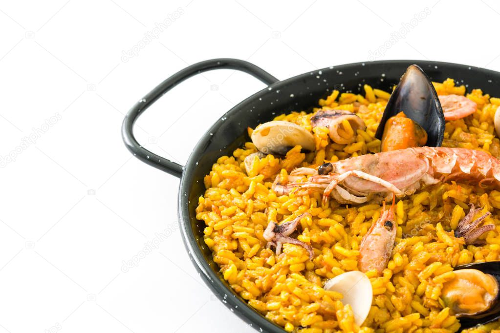 Traditional spanish seafood paella, isolated on white background