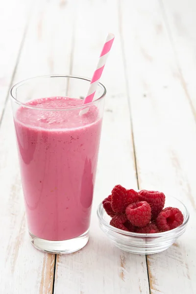 Raspberry smoothie on wooden table — Stock Photo, Image