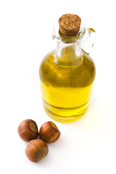 Hazelnuts oil isolated on white background