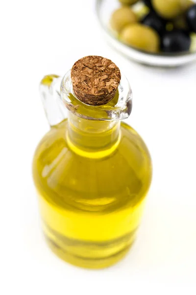 Virgin olive oil in a crystal bottle isolated on white background — Stock Photo, Image