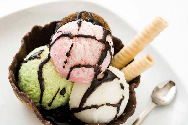 Ice cream scoops served in waffle basket isolated on white background — Stock Photo, Image