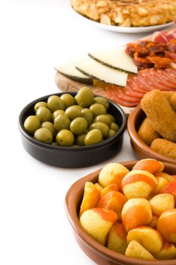 Traditional spanish tapas. Croquettes, olives,  ham and patatas bravas isolated on white background clipart