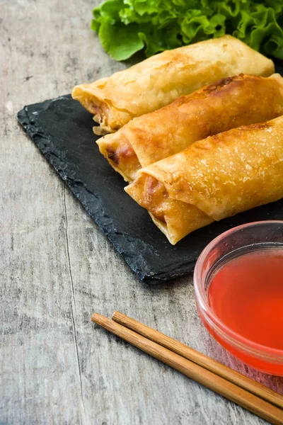 Vegetable spring rolls on wooden table background — Stock Photo, Image