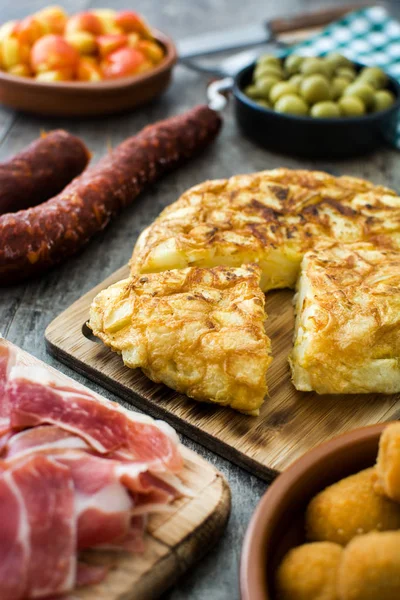 Traditional spanish tapas. Croquettes, olives, omelette, ham and patatas bravas on wood — Stock Photo, Image