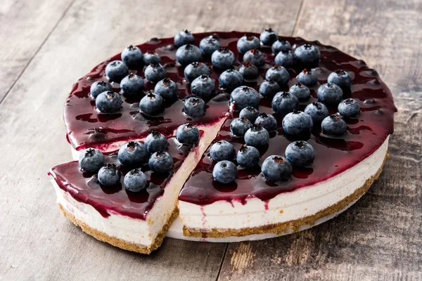 Blueberry cheesecake on wooden table — Stock Photo, Image