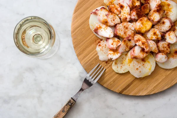 Pulpo a la gallega. Galician octopus on white marble. Typical spanish food — Stock Photo, Image