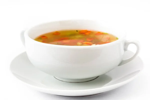 Овощной суп на белом фоне — стоковое фото