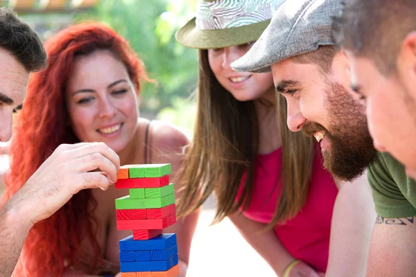 Friends playing block game — Stock Photo, Image