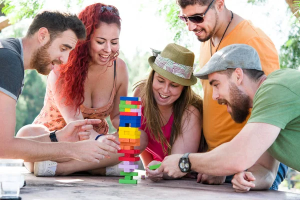 Friends playing block game — Stock Photo, Image