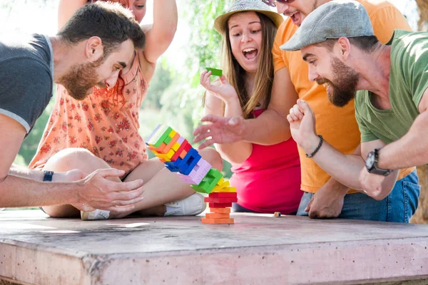 Friends playing block game — Stock Photo, Image