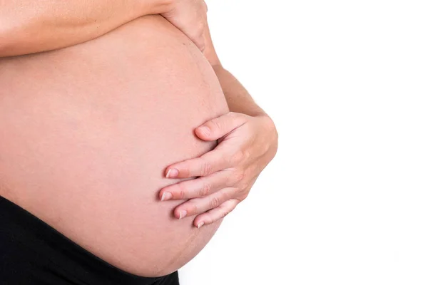 Mulher grávida isolada em fundo branco. Espaço de cópia — Fotografia de Stock