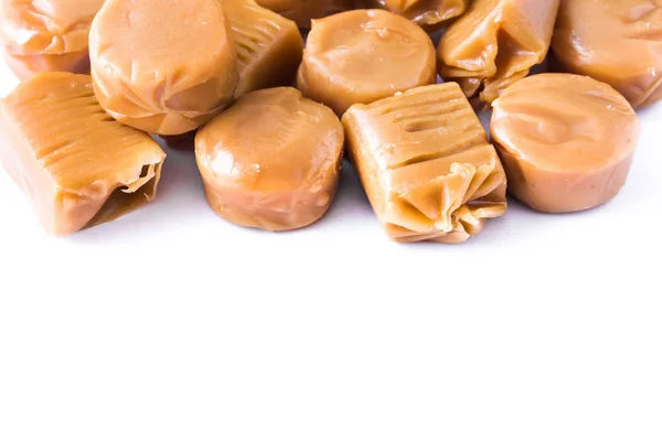 Toffee caramel candies isolated on white background. Copyspace. — Stock Photo, Image