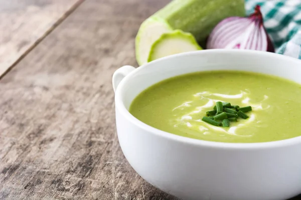 Zucchini soup in bowl on wooden table — Stock Photo, Image