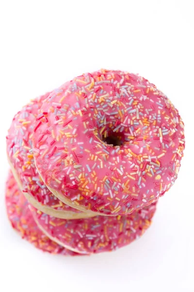 Розовый Глазированный Пончик Красочными Брызгами Белом Фоне — стоковое фото
