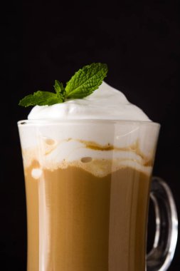 Peppermint coffee mocha for Christmas on black background