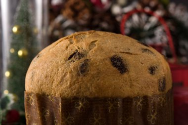 Christmas chocolate panettone cake with christmas decorated on wooden table. Close up