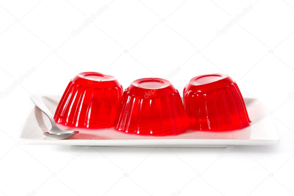 Strawberry jellies on a plate isolated on white background