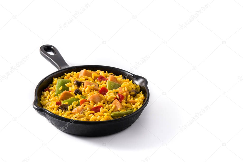 Fried rice with chicken and vegetables on frying iron pan isolated on white background. Copy space