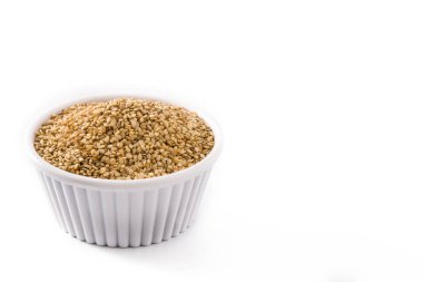 Golden flax seeds in white bow
