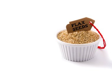 Golden flax seeds in white bow