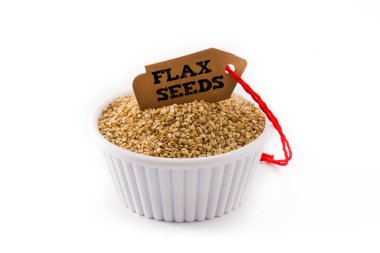 Golden flax seeds in white bow