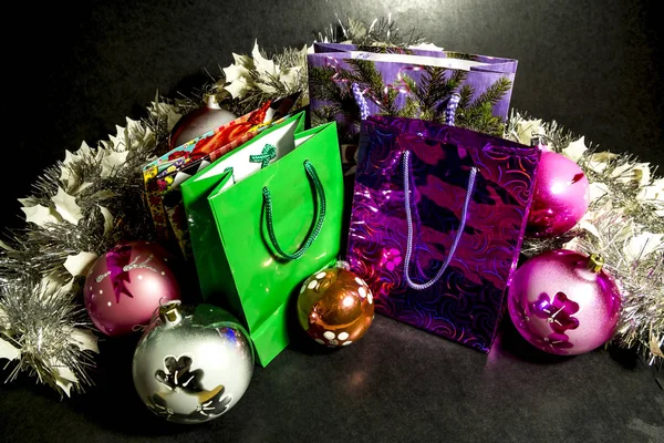 Several colorful gift bags and Christmas decorations — Stock Photo, Image