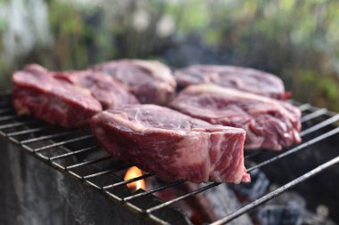 Chuck roll steak. grilled chuck roll Cooking meat by a professional cook on a bonfire in the fresh air.