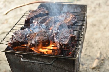Chuck roll steak. grilled chuck roll Cooking meat by a professional cook on a bonfire in the fresh air.