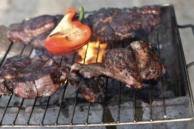 Chuck roll steak. grilled chuck roll Cooking meat by a professional cook on a bonfire in the fresh air.