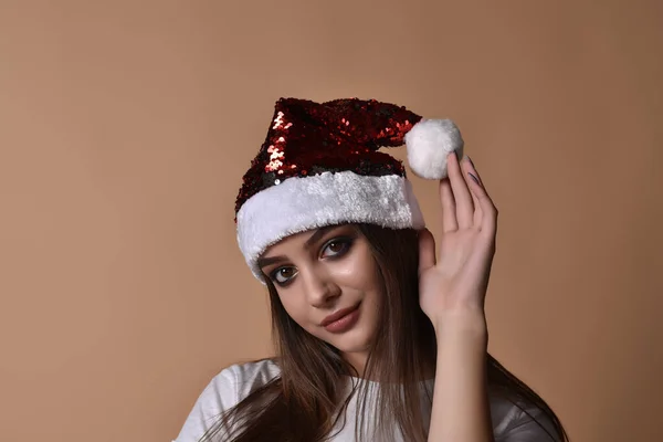 Beautiful female model wear santa hat. girl in santa hat