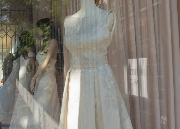 mannequin in window display. Showcase mannequin wedding dress