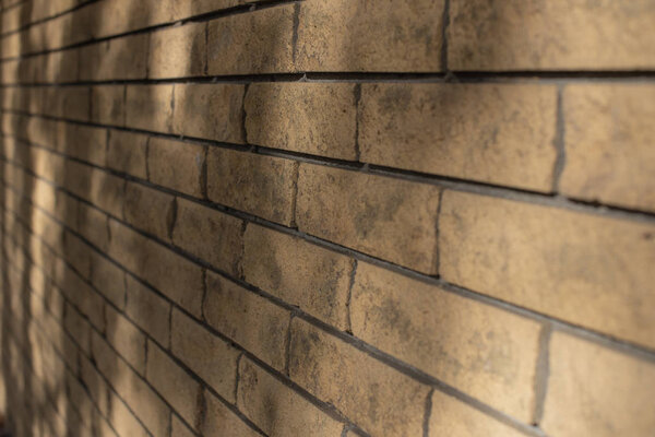 Yellow brick wall. The texture of the brick wall. Background for designers.