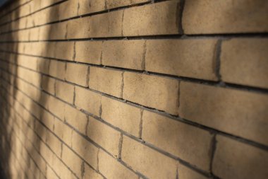 Sarı tuğla duvar. Tuğla duvarın dokusu. Tasarımcıların arkaplanı.