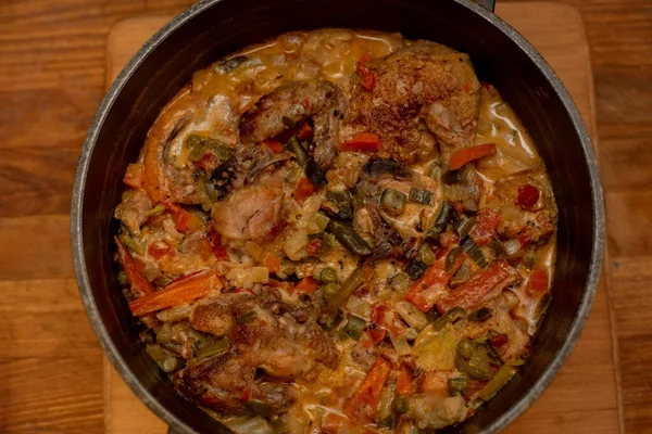 Braised chicken curry with vegetables. Asparagus, carrots, onions. Stewed chicken. Food photography