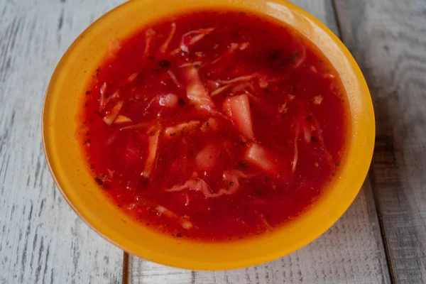 Traditional Ukrainian Russian vegetable borscht on the old wooden background — Stock Photo, Image