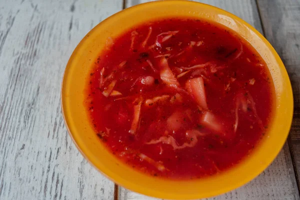 Traditional Ukrainian Russian vegetable borscht on the old wooden background — Stock Photo, Image