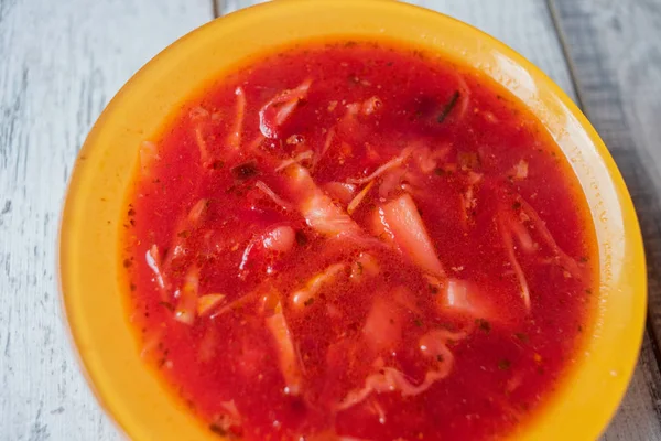 Traditional Ukrainian Russian vegetable borscht on the old wooden background — Stock Photo, Image