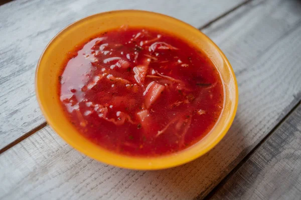 Traditional Ukrainian Russian vegetable borscht on the old wooden background — Stock Image Traditional Ukrainian Russian vegetable borscht on the old wooden background Royalty Free Stock Photos