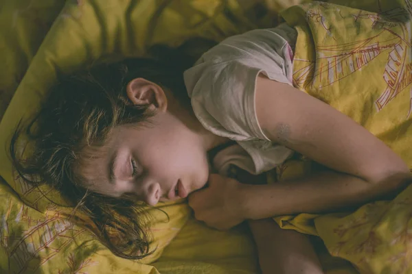 Young Girl Sleeping In Bed. 9 years old girl sleeping