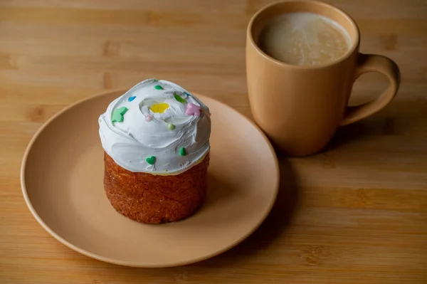 Coffee and Easter. cupcake on a plate. Easter cupcake holiday. Plate with cupcake. Easter is coming. Happy easter concept.