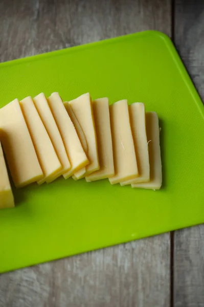 Sliced Cheese Cutting Board Top View Sliced Hard Cheese Green — Stock Photo, Image