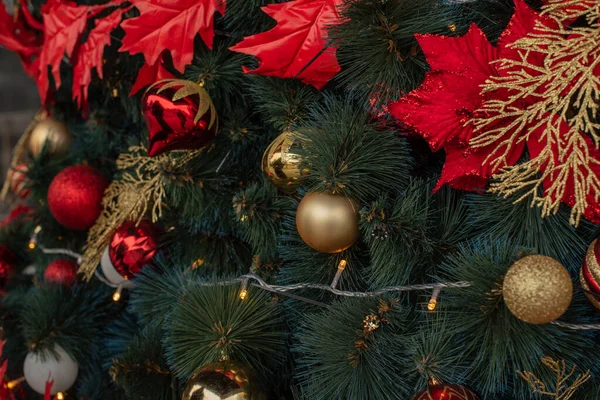 Christmas Tree. Christmas tree background. Beautiful decorated christmas. Holidays concept. New Year. Red decorations on the Christmas tree.