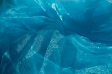 Arkaplan olarak kullanılan açık mavi doku. Mavi açık kumaş dokusu