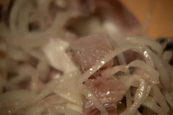 Peeled and chopped slightly salted Pacific herring with onion. Natural and healthy product. Pacific herring has a high iodine content. Blurred focus. — Stock Image Peeled Chopped Slightly Salted Pacific Herring Onion Natural Healthy Product Stock Picture