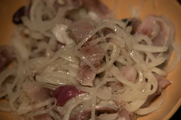 Peeled and chopped slightly salted Pacific herring with onion. Natural and healthy product. Pacific herring has a high iodine content. Blurred focus. — Stock Image Peeled Chopped Slightly Salted Pacific Herring Onion Natural Healthy Product Stock Photo