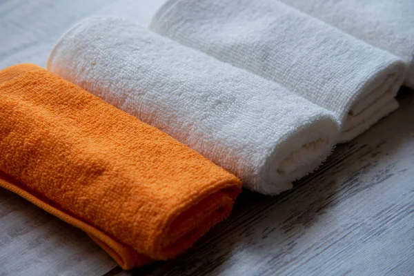 White Towels. Beautifully matched clean or new towels on the table. Hotel Cleanliness Beauty Salon Concept